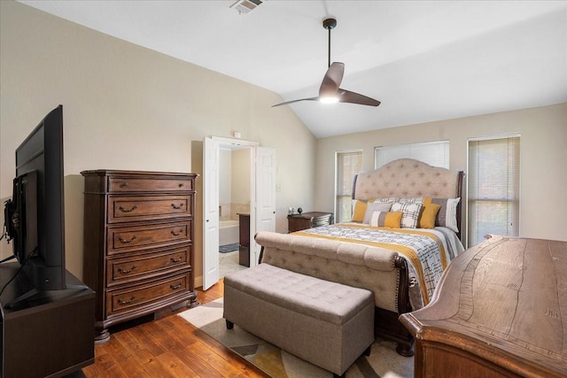 2098 Amber Ct, Lewisville, TX 75067 - bedroom featuring wood finished floors, vaulted ceiling, ceiling fan, and ensuite bathroom