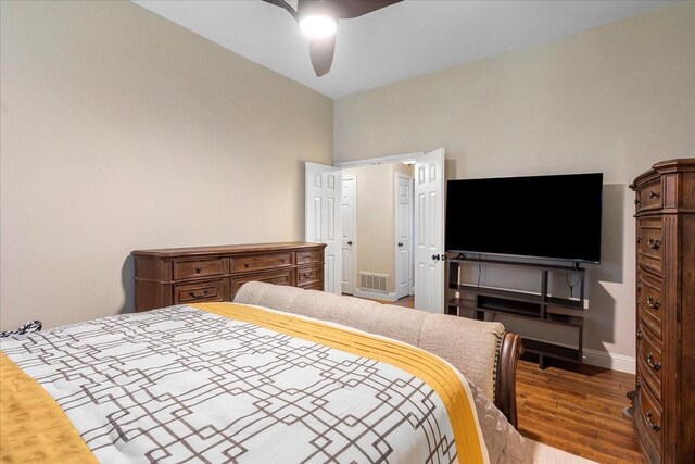 2098 Amber Ct, Lewisville, TX 75067 - bedroom featuring wood finished floors, baseboards, and ceiling fan