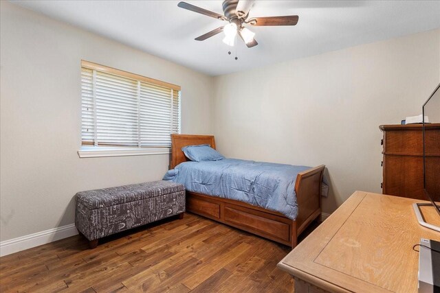 2098 Amber Ct, Lewisville, TX 75067 - bedroom with wood finished floors, baseboards, and a ceiling fan