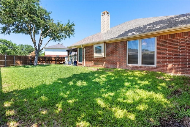 2098 Amber Ct, Lewisville, TX 75067 - back of house with brick siding, a chimney, and roof with shingles