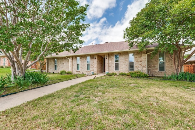 1513 Silverleaf Dr, Carrollton, TX 75007 - view of front facade featuring a front yard and brick siding