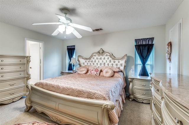 1513 Silverleaf Dr, Carrollton, TX 75007 - carpeted bedroom with a textured ceiling and ceiling fan