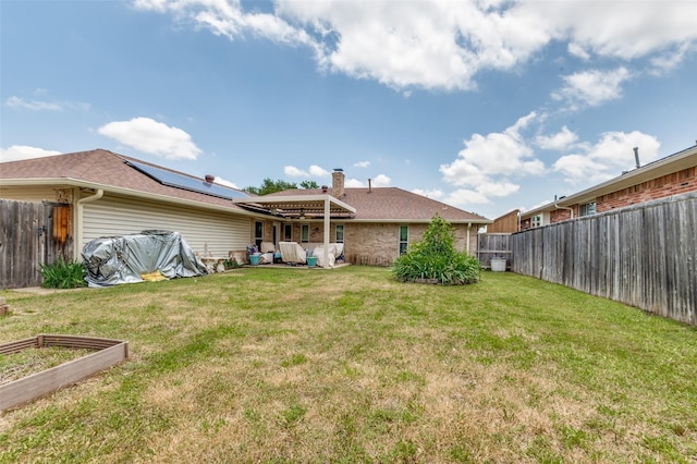 1513 Silverleaf Dr, Carrollton, TX 75007 - rear view of property with solar panels, a garden, brick siding, and a chimney