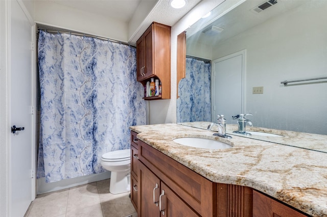 1513 Silverleaf Dr, Carrollton, TX 75007 - full bath featuring vanity, tile patterned flooring, and toilet