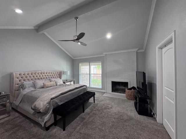 bedroom with carpet flooring, ornamental molding, a fireplace, and a ceiling fan