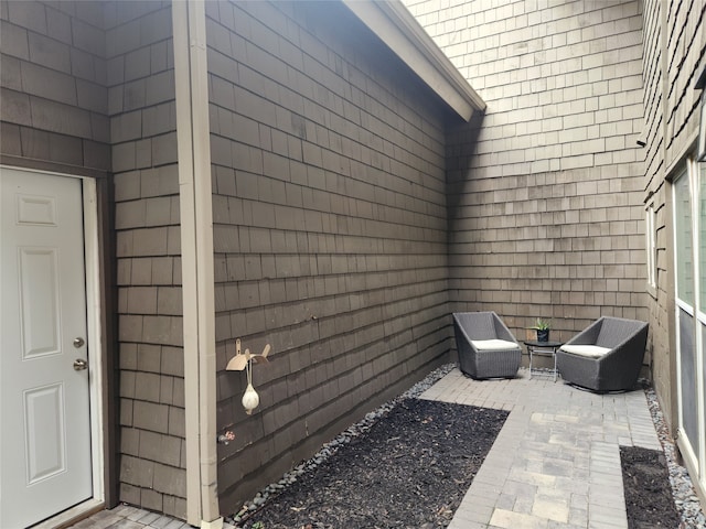 entrance to property featuring a patio