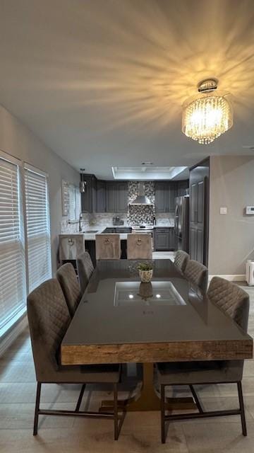 dining room featuring a chandelier