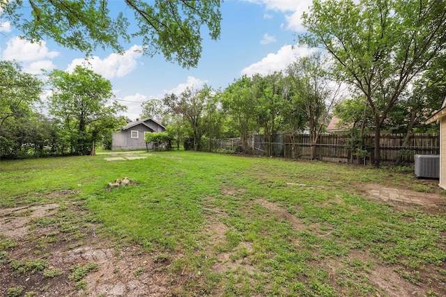 view of yard with central AC