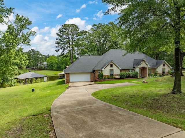 23196 J E B Cir, Frankston, TX 75763 - traditional home featuring brick siding, driveway, a front lawn, and an attached garage