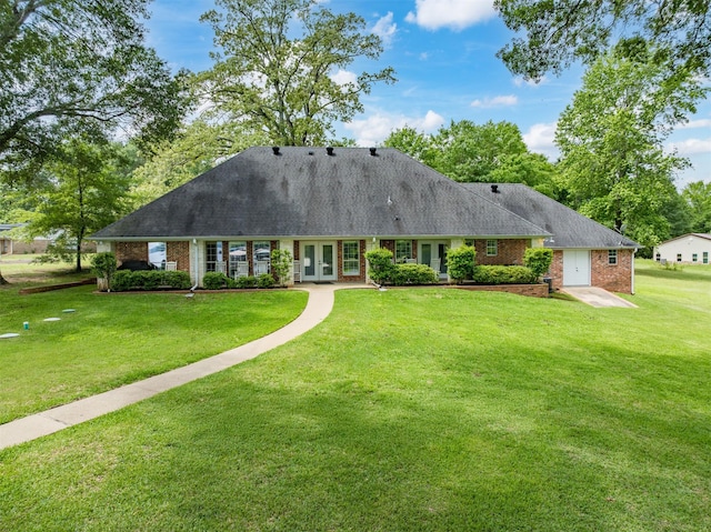 23196 J E B Cir, Frankston, TX 75763 - view of front of house with french doors, brick siding, a front yard, and roof with shingles