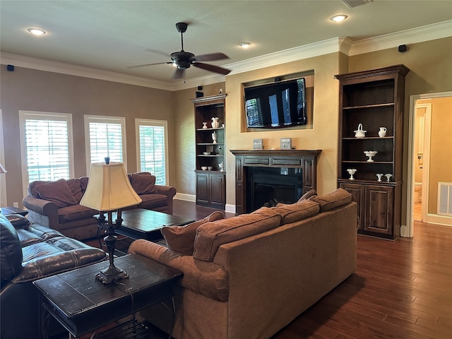 23196 J E B Cir, Frankston, TX 75763 - living room featuring a fireplace, ceiling fan, dark wood-style floors, recessed lighting, and ornamental molding