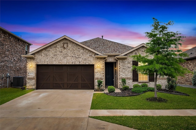 3433 Alamosa River Dr, Celina, TX 75078 - view of front of house with an attached garage, driveway, a yard, cooling unit, and a shingled roof