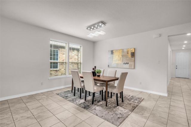 3433 Alamosa River Dr, Celina, TX 75078 - dining space featuring light tile patterned flooring and baseboards