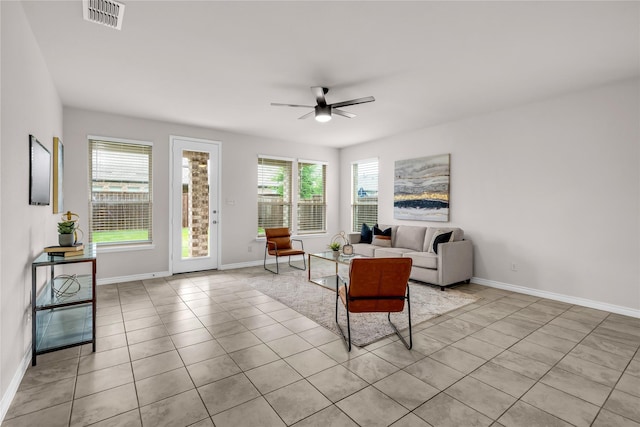 3433 Alamosa River Dr, Celina, TX 75078 - living room featuring plenty of natural light, ceiling fan, baseboards, and light tile patterned floors