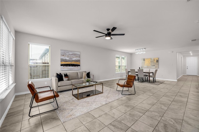 3433 Alamosa River Dr, Celina, TX 75078 - living room with light tile patterned floors, ceiling fan, and baseboards
