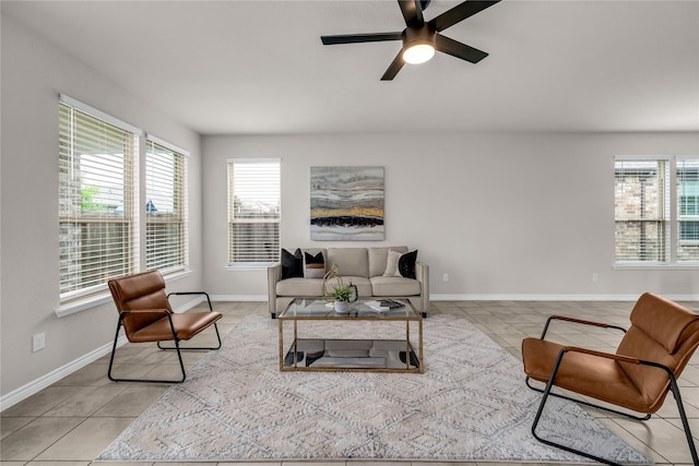 3433 Alamosa River Dr, Celina, TX 75078 - living area featuring plenty of natural light, light tile patterned flooring, ceiling fan, and baseboards