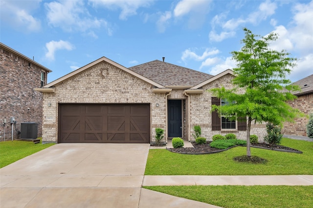 3433 Alamosa River Dr, Celina, TX 75078 - view of front of property featuring a garage, central AC unit, a front lawn, driveway, and roof with shingles