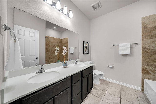 3433 Alamosa River Dr, Celina, TX 75078 - full bath with tiled shower, baseboards, a tub to relax in, toilet, and double vanity