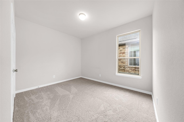 3433 Alamosa River Dr, Celina, TX 75078 - spare room featuring carpet and baseboards