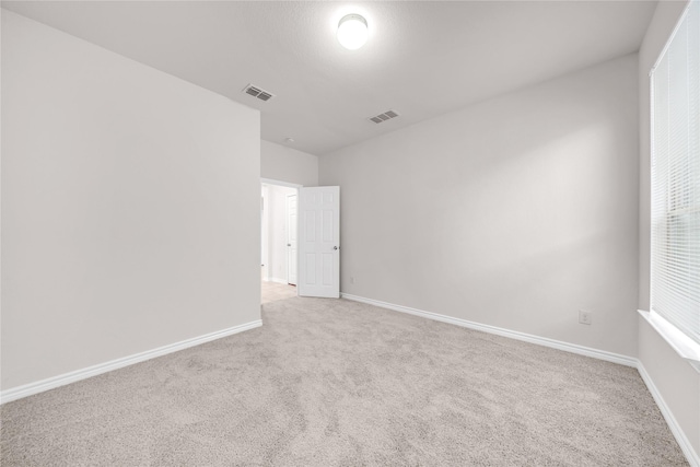 3433 Alamosa River Dr, Celina, TX 75078 - spare room featuring light carpet and baseboards