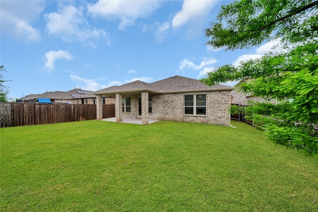 3433 Alamosa River Dr, Celina, TX 75078 - back of property featuring a patio and brick siding