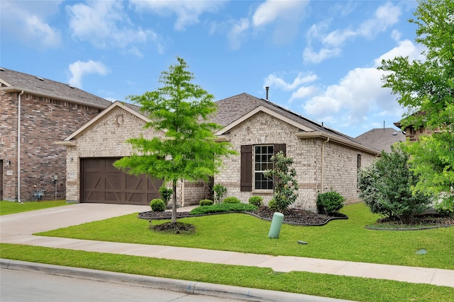 3433 Alamosa River Dr, Celina, TX 75078 - view of front of property with an attached garage, a front lawn, concrete driveway, brick siding, and roof with shingles