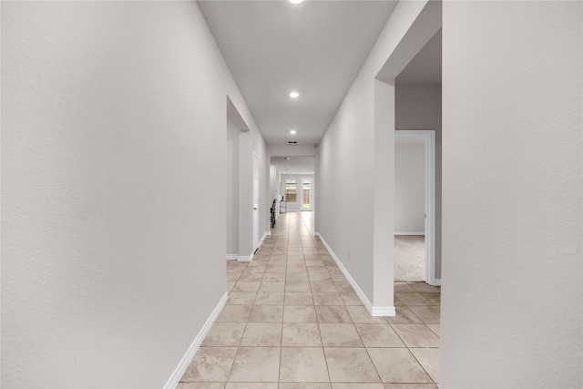 3433 Alamosa River Dr, Celina, TX 75078 - hallway with recessed lighting, light tile patterned flooring, and baseboards