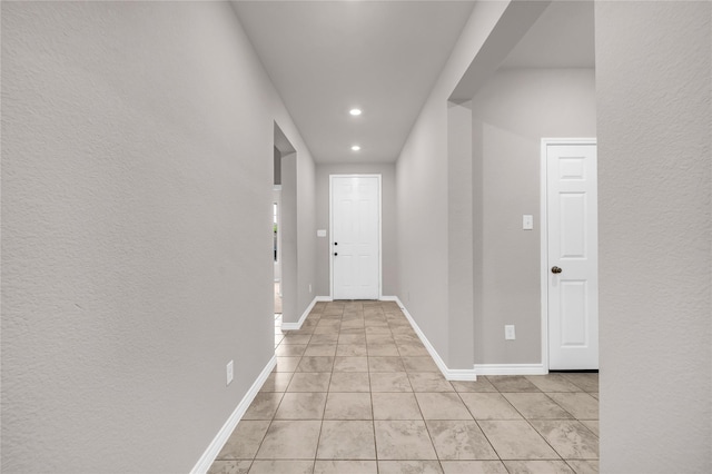 3433 Alamosa River Dr, Celina, TX 75078 - hallway featuring recessed lighting, light tile patterned floors, and baseboards