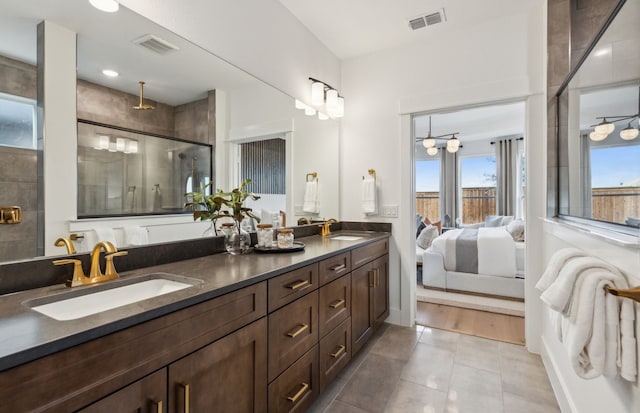 2824 Tophill Dr, Celina, TX 75009 - ensuite bathroom featuring double vanity, tiled shower, and tile patterned floors