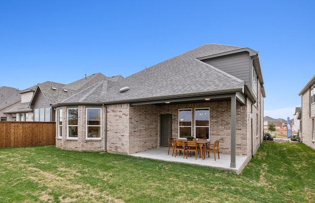 2824 Tophill Dr, Celina, TX 75009 - back of house with a patio, brick siding, and roof with shingles