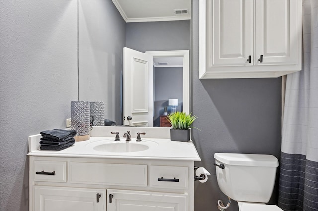 4290 Castle Bank Ln, Frisco, TX 75033 - bathroom featuring toilet, ornamental molding, vanity, and a textured wall