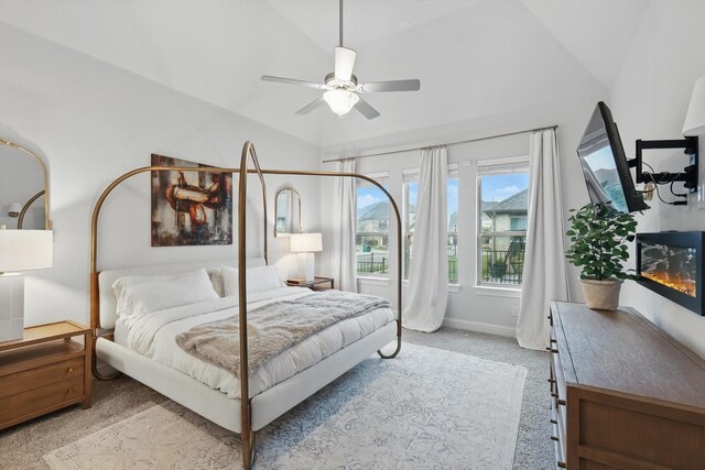 bedroom with lofted ceiling, carpet flooring, ceiling fan, and baseboards