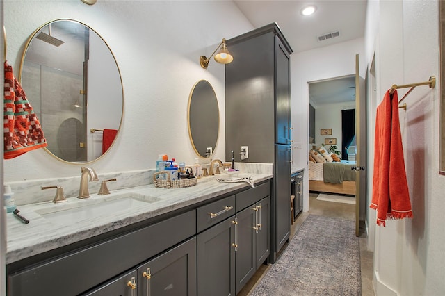bathroom featuring double vanity, ensuite bath, and a shower