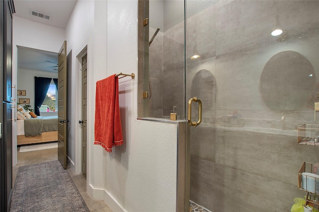 bathroom featuring tiled shower and connected bathroom