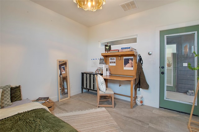 bedroom featuring concrete floors and baseboards