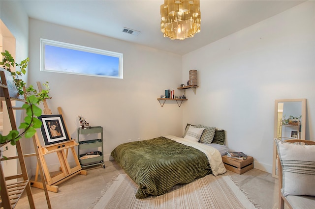 bedroom featuring a chandelier and baseboards