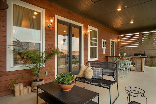view of patio / terrace featuring covered porch and french doors