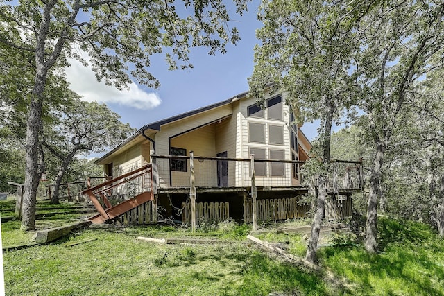 41 Crestline Ct, Nocona, TX 76255 - rear view of property with stairway and a deck