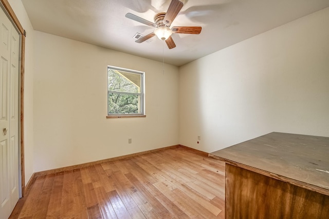 41 Crestline Ct, Nocona, TX 76255 - unfurnished bedroom featuring light wood-style floors, a closet, baseboards, and ceiling fan
