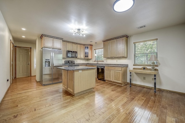 41 Crestline Ct, Nocona, TX 76255 - kitchen with black appliances, a center island, light wood-type flooring, plenty of natural light, and recessed lighting