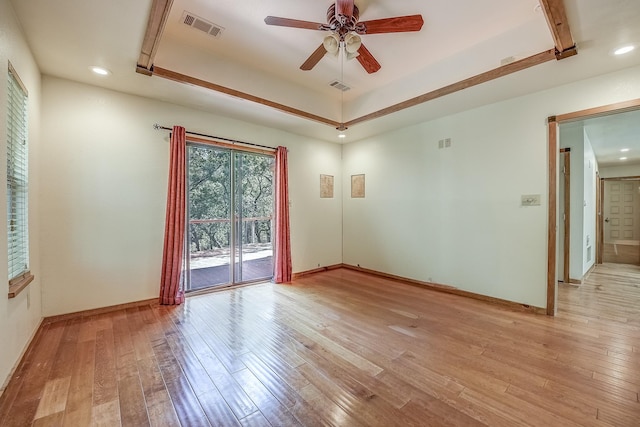 41 Crestline Ct, Nocona, TX 76255 - spare room with light wood-style flooring, a ceiling fan, baseboards, recessed lighting, and a tray ceiling