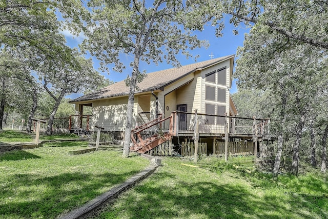 41 Crestline Ct, Nocona, TX 76255 - back of house featuring stairs, a deck, a lawn, and a shingled roof