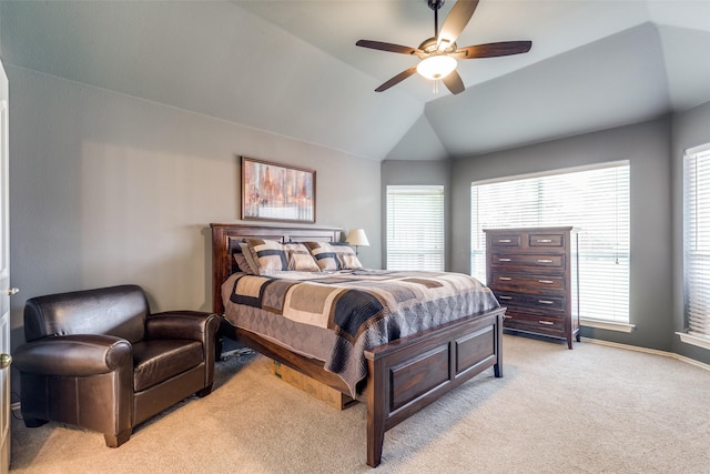 bedroom featuring light carpet, lofted ceiling, a ceiling fan, and baseboards