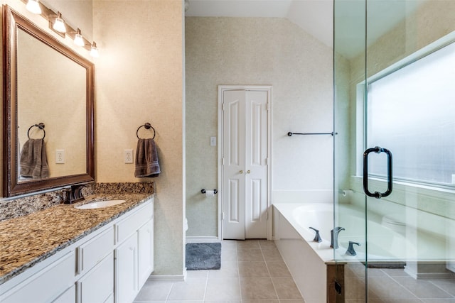 bathroom with tile patterned flooring, vanity, a bath, a shower stall, and lofted ceiling