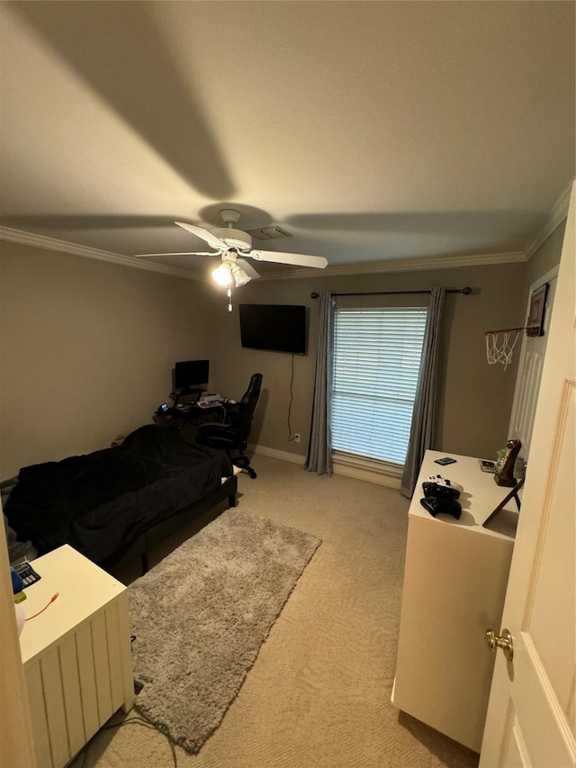 bedroom featuring ornamental molding, light colored carpet, ceiling fan, and baseboards