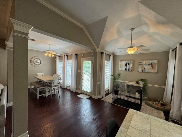 foyer with a ceiling fan, crown molding, dark wood-style floors, ornate columns, and baseboards