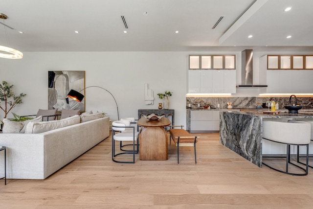 living room featuring light wood-style floors and recessed lighting