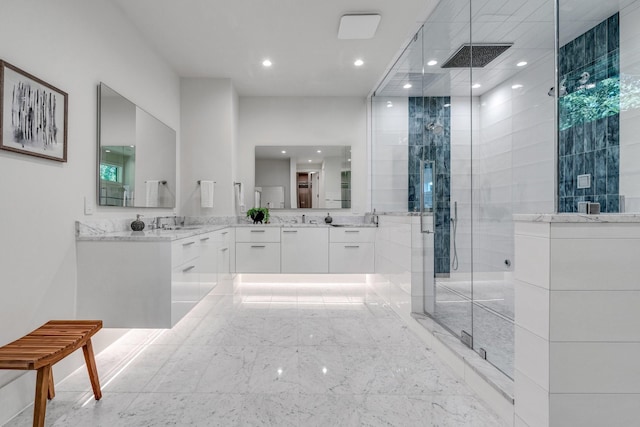 full bath featuring a shower stall, recessed lighting, vanity, and marble finish flooring