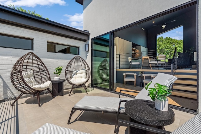 view of patio / terrace featuring ceiling fan