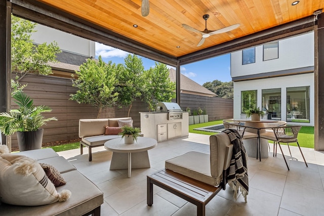 view of patio with grilling area, an outdoor hangout area, area for grilling, a fenced backyard, and outdoor dining area
